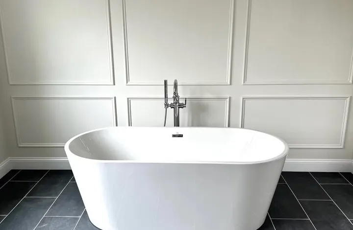 Freestanding soaking tub on slate tile in a Haddam, CT bathroom remodel