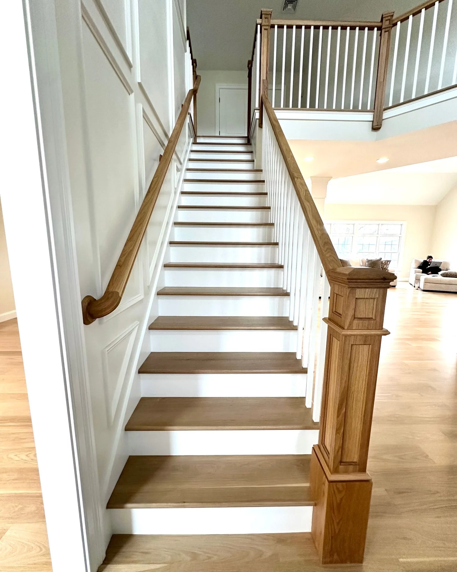 Hardwood staircase treads and railing installed by River's Edge Home Center