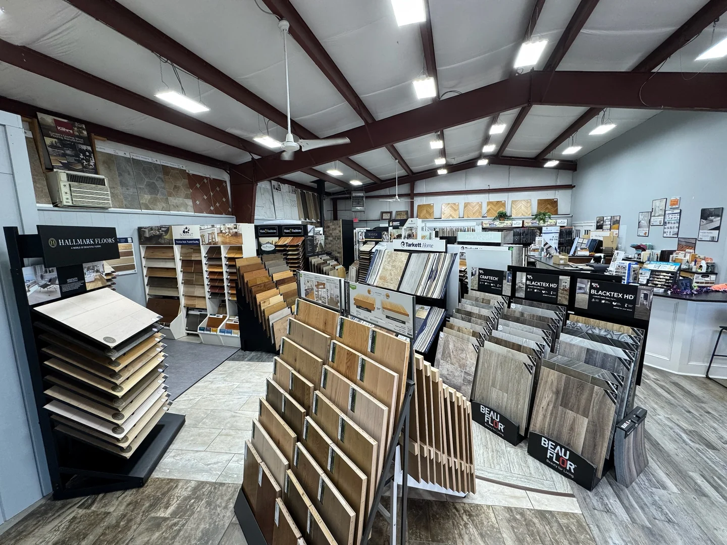 Flooring, tile and countertop displays across the River's Edge Home Center showroom in Haddam, CT