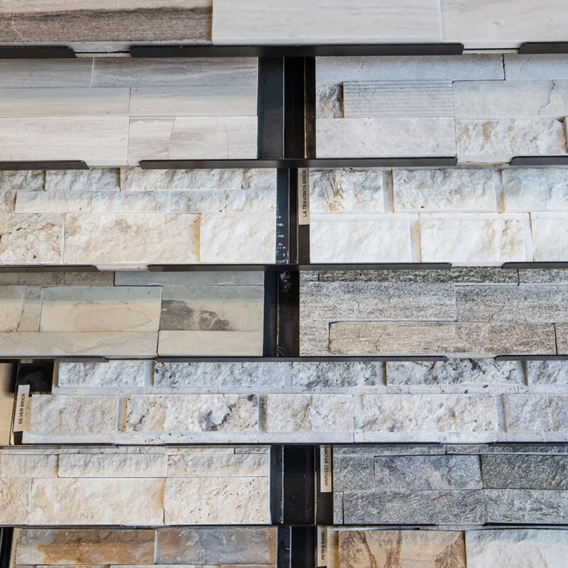Stacked stone and tile sample boards in the River's Edge showroom
