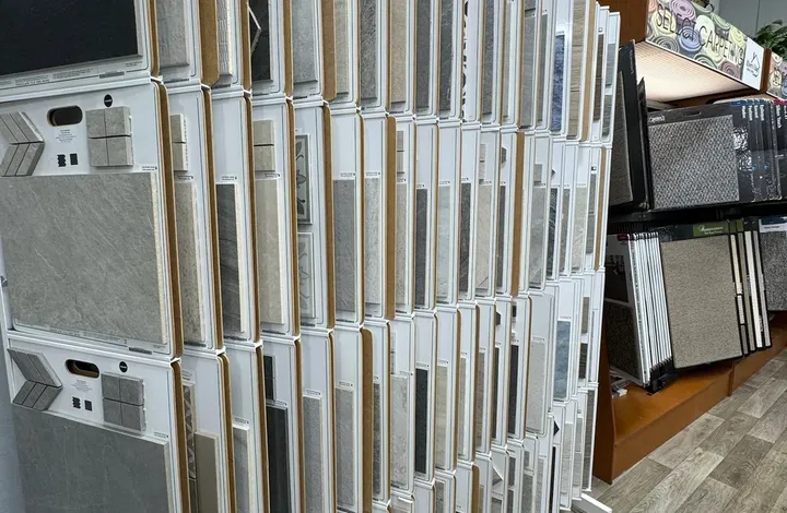 Tile and stone sample boards on the showroom rack